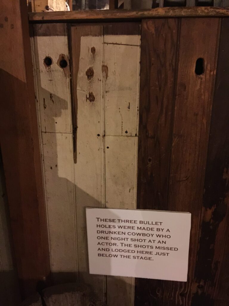 Bullet holes in the wall at the Birdcage Theater