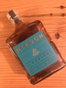 Front view of Hirsch Whiskey bottle with label.