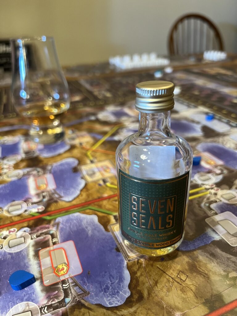 Whiskey glass on a game board.